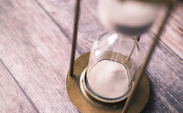 Hour glass with sand falling. 