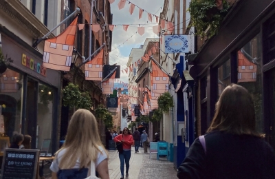 Student image of two students walking down the street.